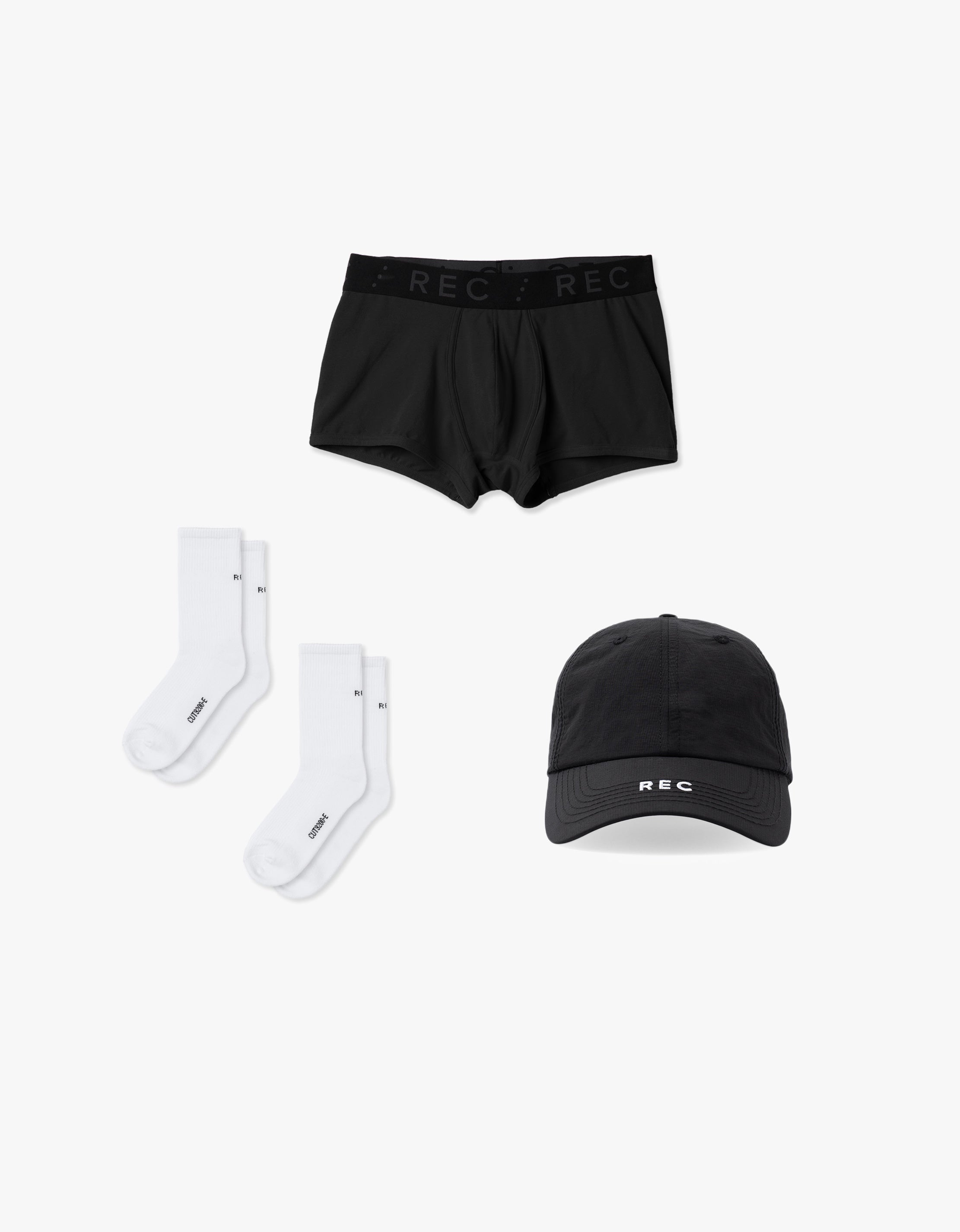 Black underwear, socks, and cap with 'REC' branding on a white background